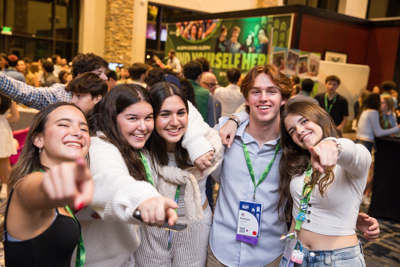 Group of people celebrating on stage