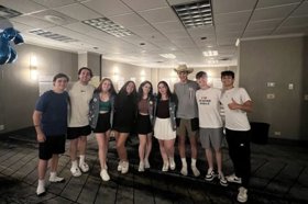 Group of people celebrating on stage