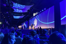 Group of people celebrating on stage