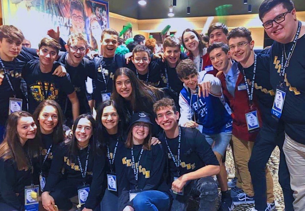 Group of people celebrating on stage