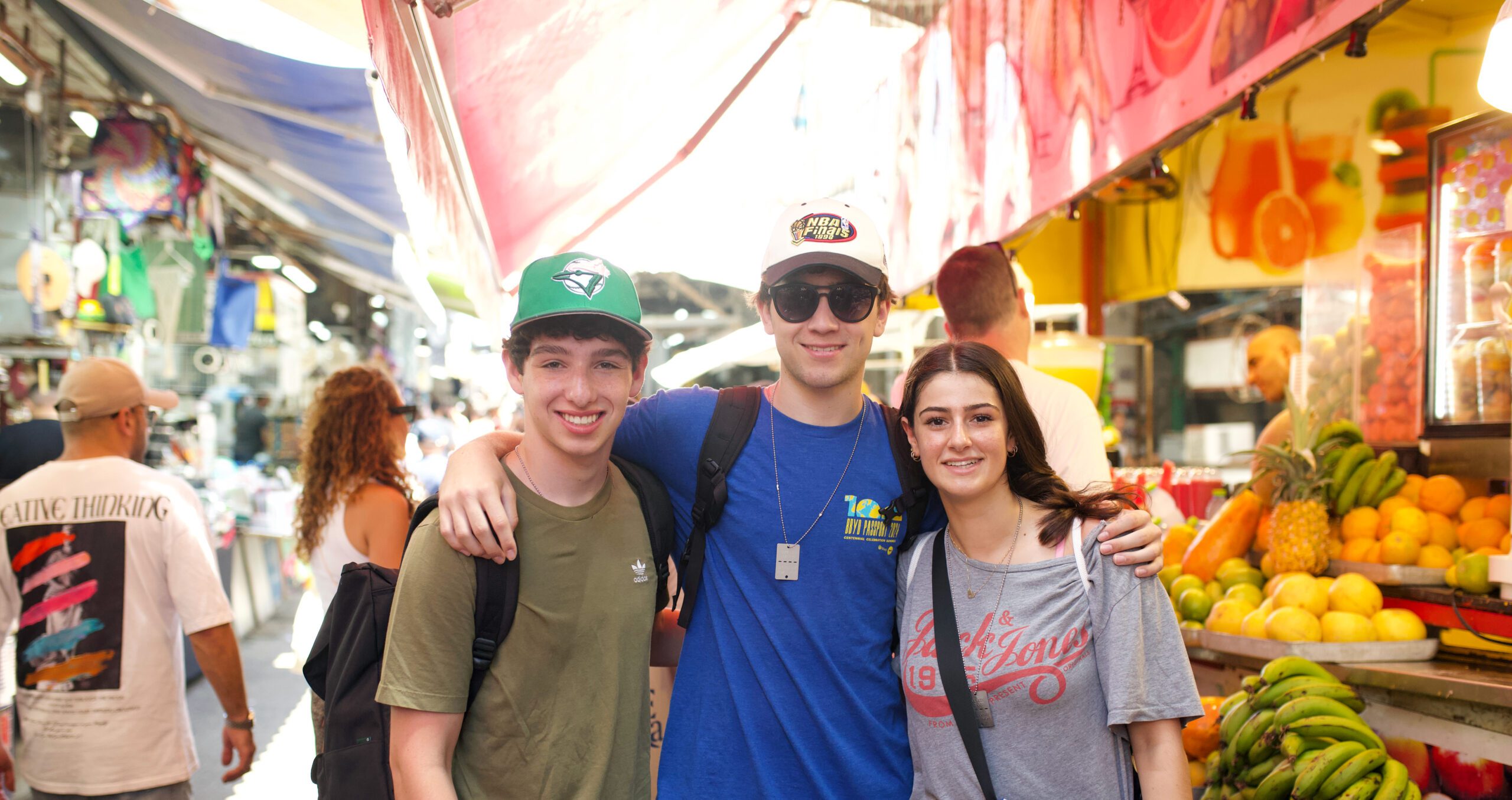 Group of diverse young people smiling at a community event