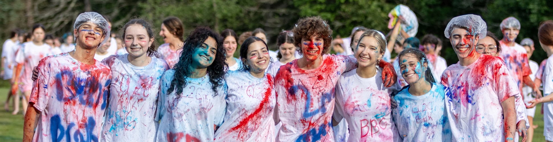Group of diverse young people smiling at a community event