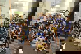 Group of people celebrating on stage