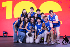 Group of people celebrating on stage