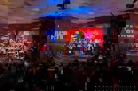 Group of people celebrating on stage