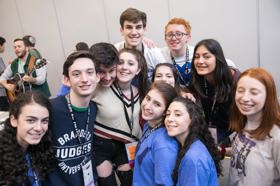 Group of people celebrating on stage