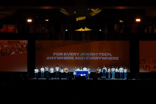 Group of people celebrating on stage
