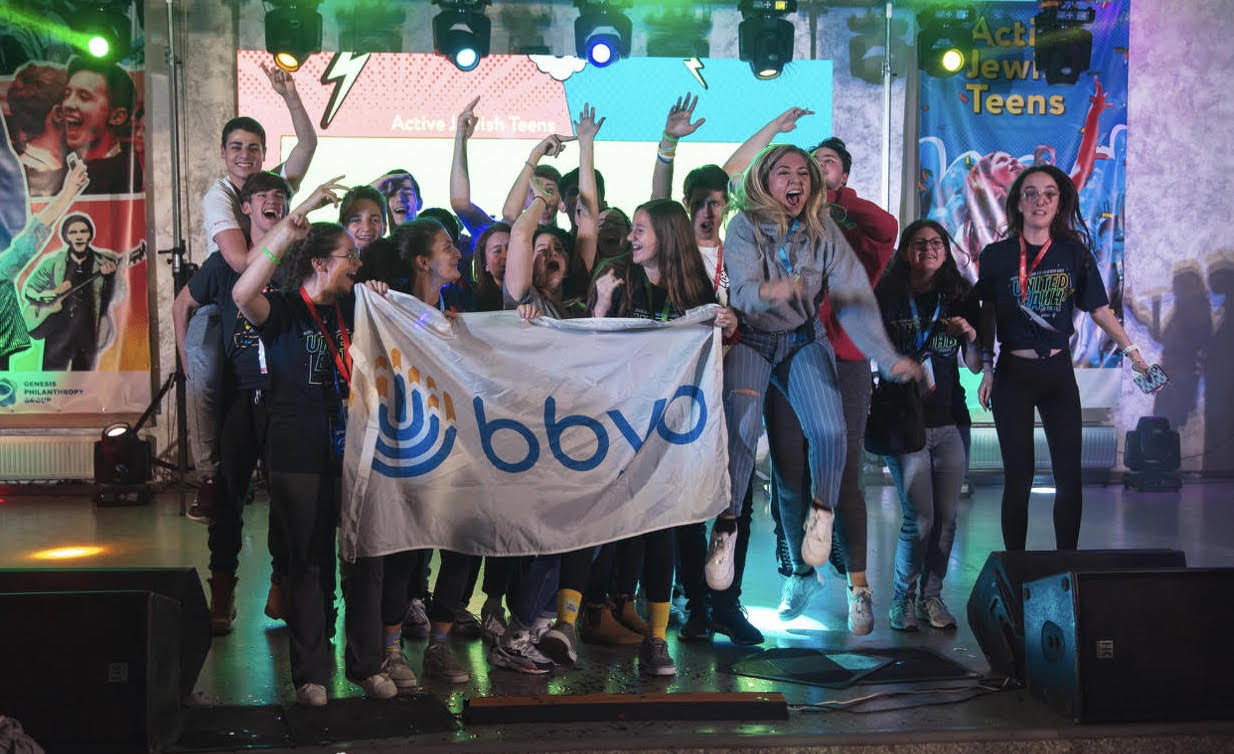 Group of people celebrating on stage