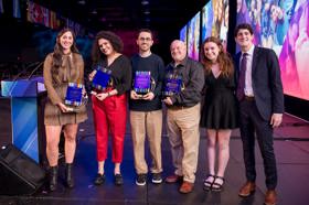 Group of people celebrating on stage