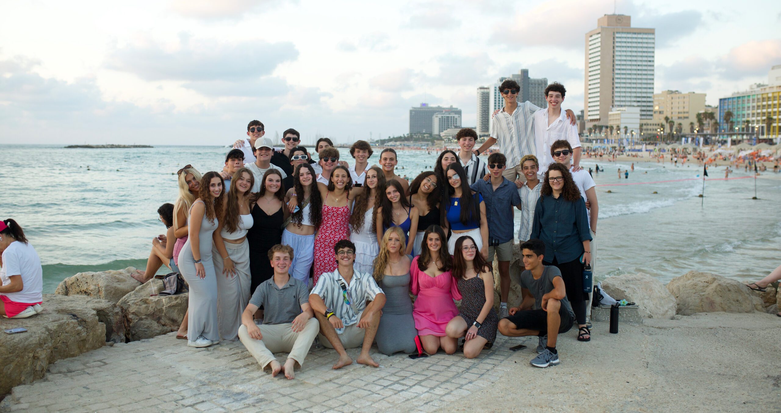 Group of diverse young people smiling at a community event