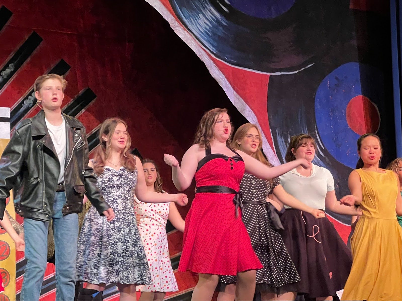 Group of people celebrating on stage