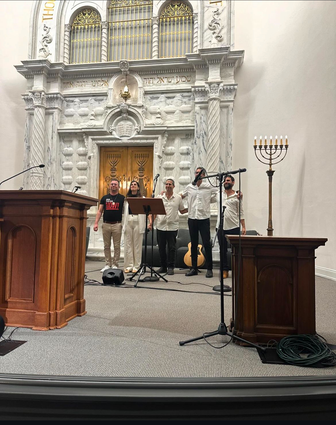 Group of people celebrating on stage