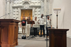 Group of people celebrating on stage